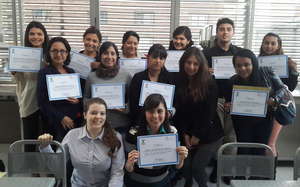 Proud group holding up their diplomas!