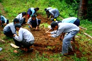 Students dig to bring the wasteland into use.