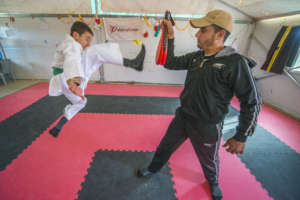 A Syrian boy practices Taekwondo