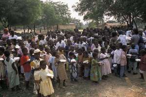 A section of children receiving christmas meals