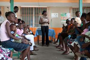 Women and toddlers getting care at clinic