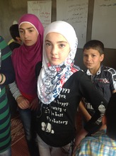 Young Syrian refugee in her classroom