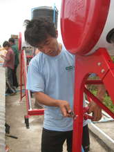 Mr Chiang Kaw working on the solar collectors