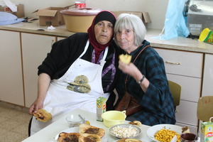 Barbara Lubin and Um Hassan eating breakfast