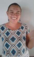 A smiling Nancy, happy about her business