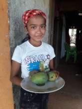 Genesis with her mangoes.