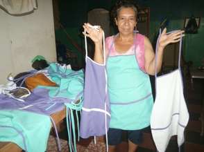 Adelina displays her aprons