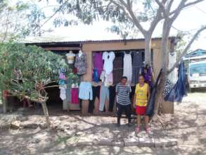 Angela and her son showing the business