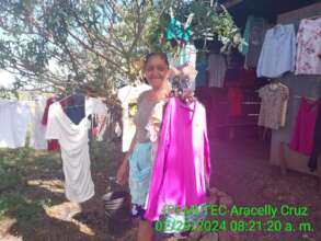 Angela organizing the clothes for clients to see