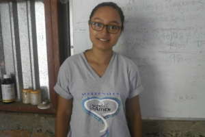 Gema smiling for her photo at the training center