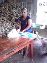 Miriam making tortillas