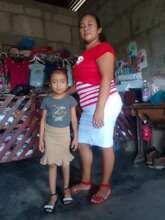 Eveling and her child proud of her business