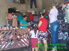 People purchasing products in Evelings business