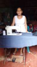 Yessenia with her sewing machine.