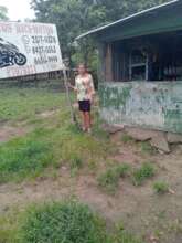 Margarita with her business sign