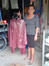 Margarita offering raincoats