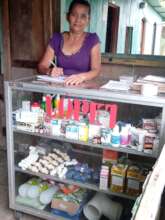Margarita keeping records of her business
