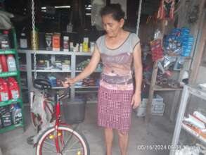 Margarita selling a bicycle