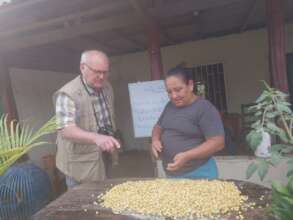 Juana showing the corn that will be baked soon