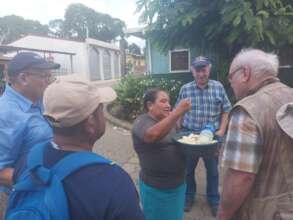 Juana explaining the product she is selling