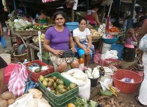 Martha selling her products at the local market