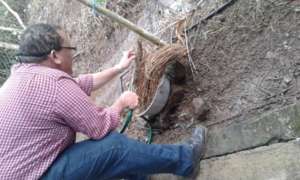 Country Program Director Jorge observing old oven