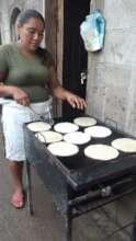 Rosa cooking the tortillas in her new gas griddle