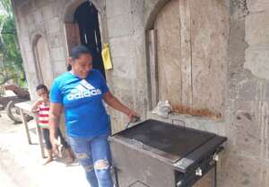 Rosa demonstrating her new gas griddle