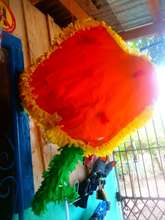 Women make pinatas to sell for celebratory events
