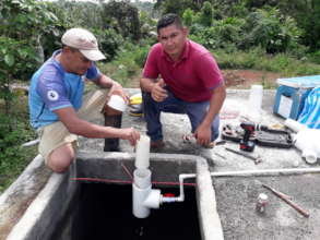 Installing a chlorinator in a water system.