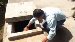 Orlando inspecting the chlorinator.