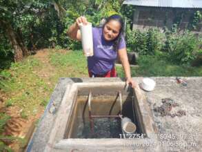 Karla checking the proper use of the Chlorinator