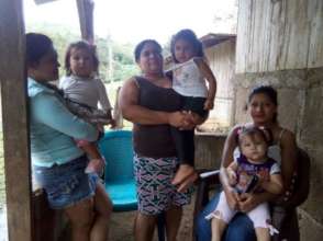 Brenda with her family discussing water quality