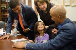 Sadin grins after Sen. Feinstein gave her a book
