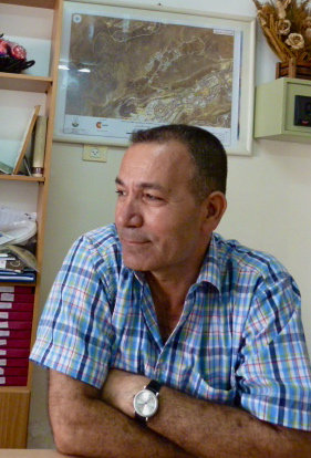Fahmi Manasra with map of settlement encroachment
