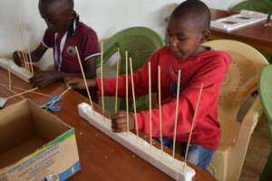 Creating an Abacus with recycled materials!