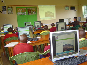 Mbaikini class exploring on photo slides