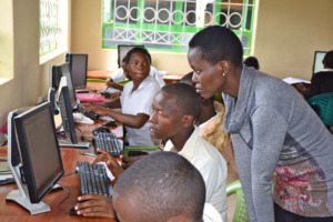 Irene working with students on computer skills