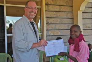 Mr. Gregory awards certificates to the students
