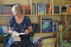 Theresa Vorce helps in  cataloguing the books