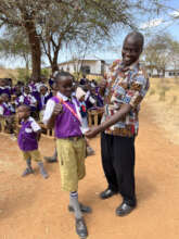 James Musyoka awards a library card