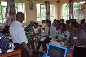 Mr. Mataloo instructs on using tablets