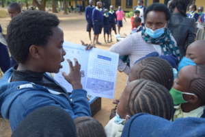 Edith Distributes Guides to Students