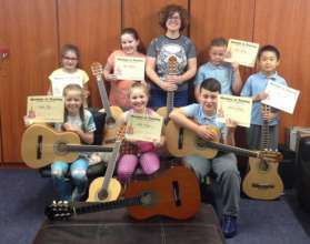 Guitar group showing off their Certificates