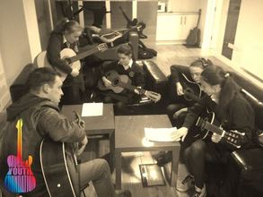Teaching guitar to some of our new beginners
