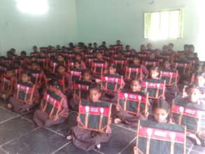 Given School Bags to Children
