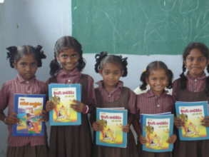 Children are showing their books.