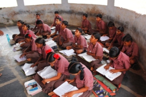 Children are reading in the class room.
