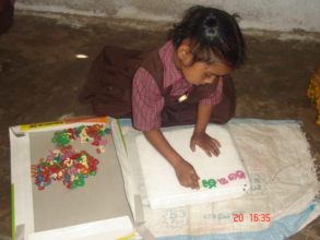 Child is playing with alphabets