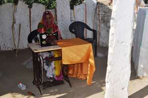 SHG member with her new sewing machine..